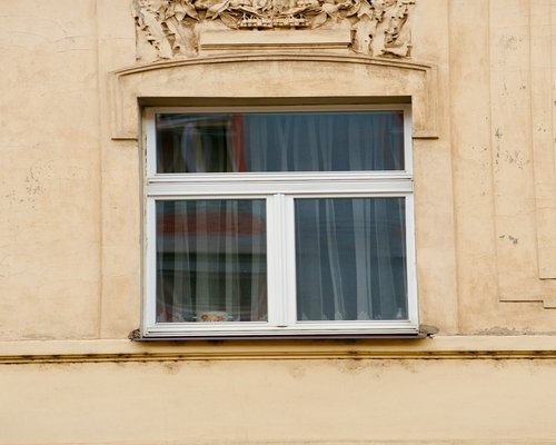Close up of a person looking out a window during a workday break