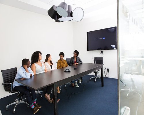 Group of professionals having a meeting in a bright modern office in Colombia